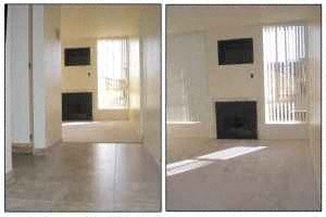 A living room with a fireplace and a television.