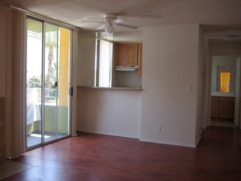A room with a sliding glass door leading to a patio.