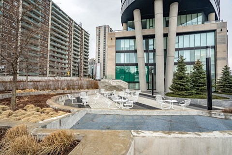 A modern building with a pool in front.