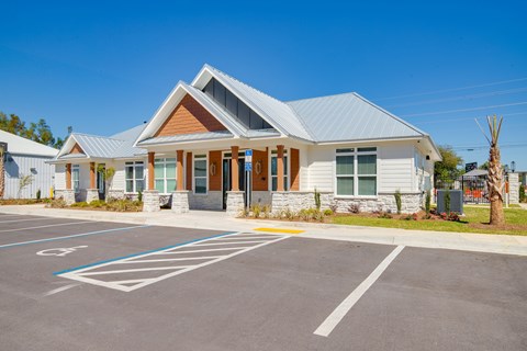 A building with a parking lot in front of it.