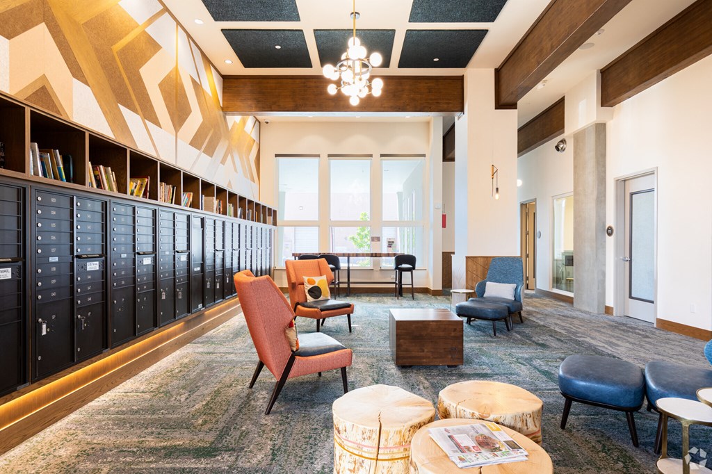 A room with a carpeted floor and a wooden ceiling with a chandelier.