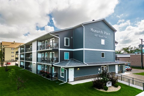 A large grey building with Monarch Place written on the side.