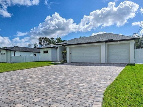A house with a driveway in front of it.
