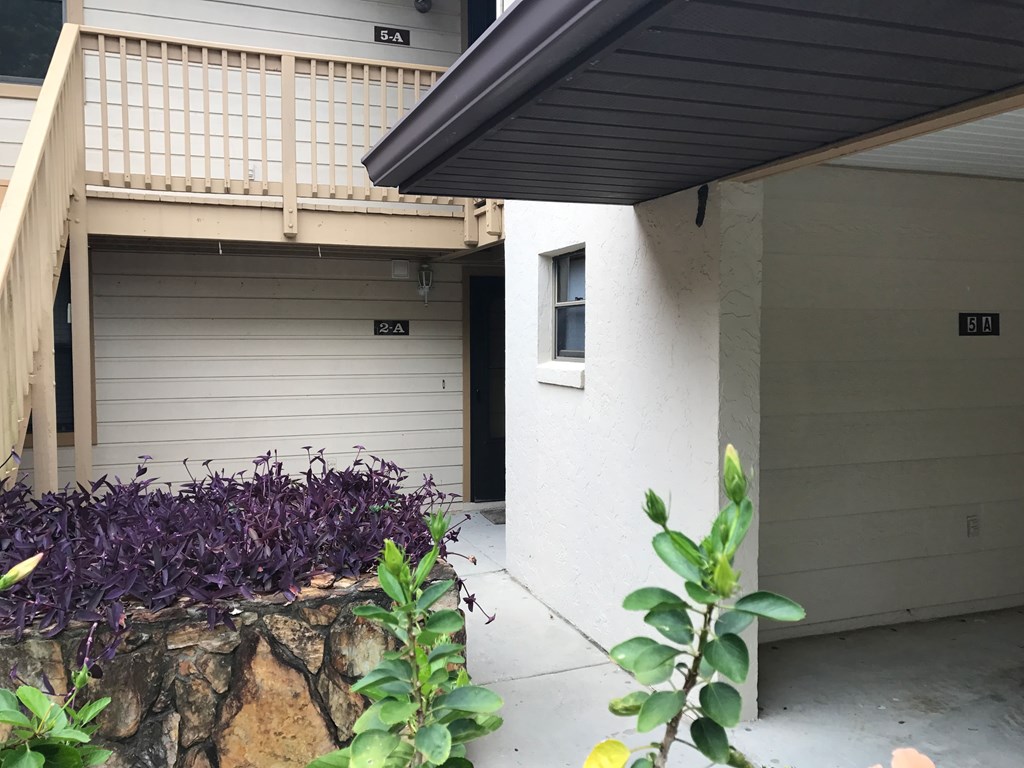 A white garage door with a number 3A on it.