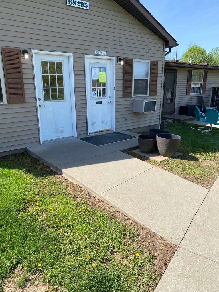 A small building with the number 68295 on the top.