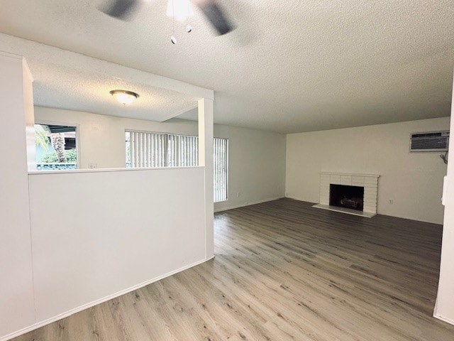 A room with a fireplace and a window with blinds.