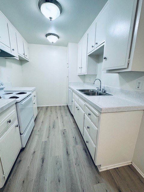 A kitchen with white appliances and cabinets.