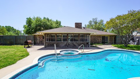 A house with a pool in the backyard.