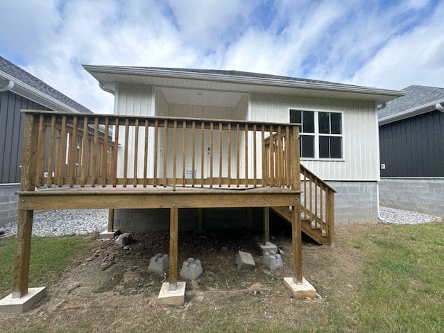 A house under construction with a wooden deck.