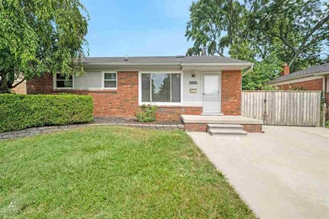 A house with a white door and a small porch.