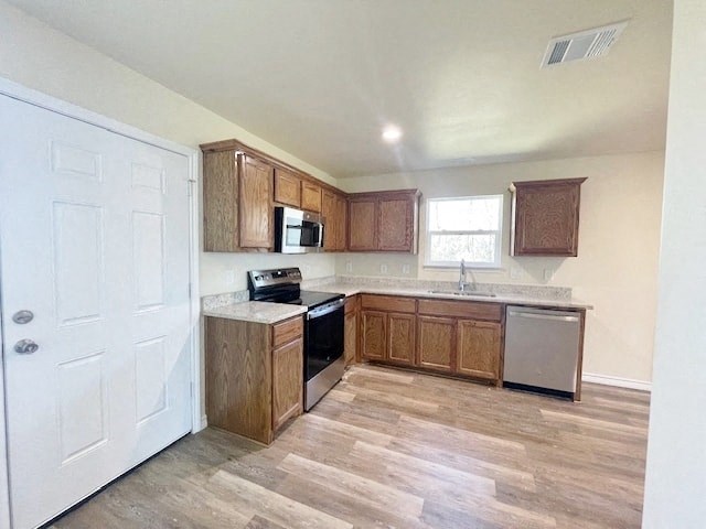 A kitchen with wooden cabinets and a white door.