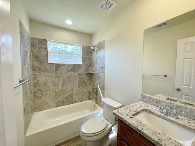 A bathroom with a tub, toilet, and sink.