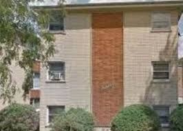 A building with a brick wall and a window.