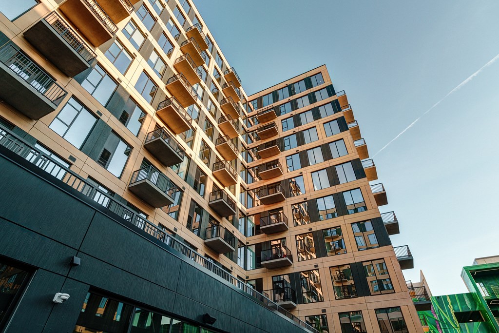 A modern building with balconies and windows.