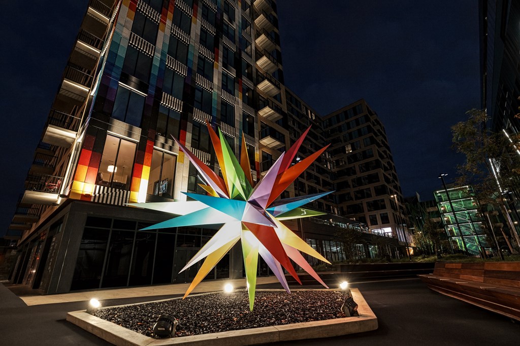 A large, colorful star sculpture is the focal point of this image.