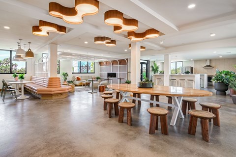 A modern dining area with a round table and chairs.