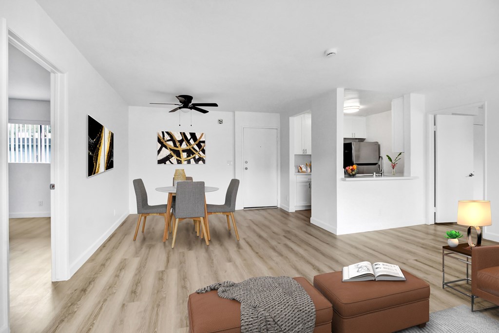 A living room with a grey table and chairs.