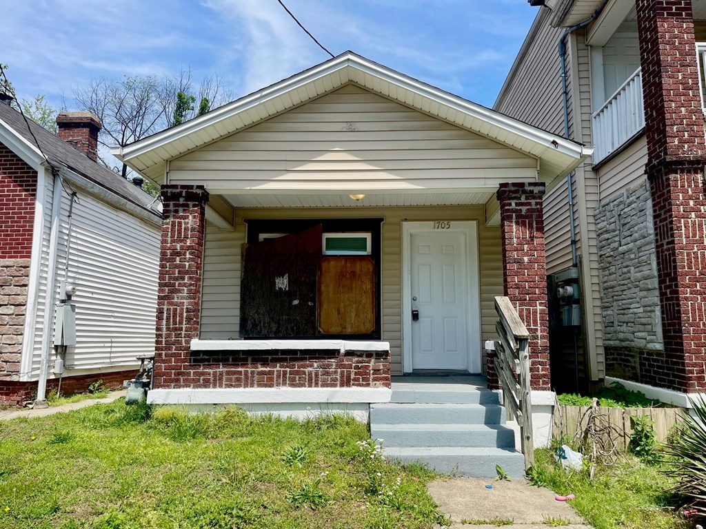 A house with a brown door and a white front door.