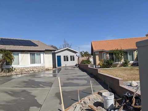 A residential area with houses and a clear sky.