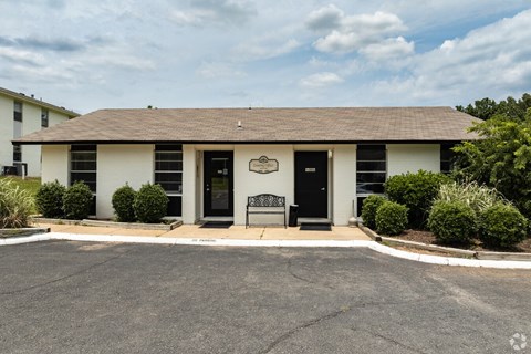 A building with a black door and a sign above it.