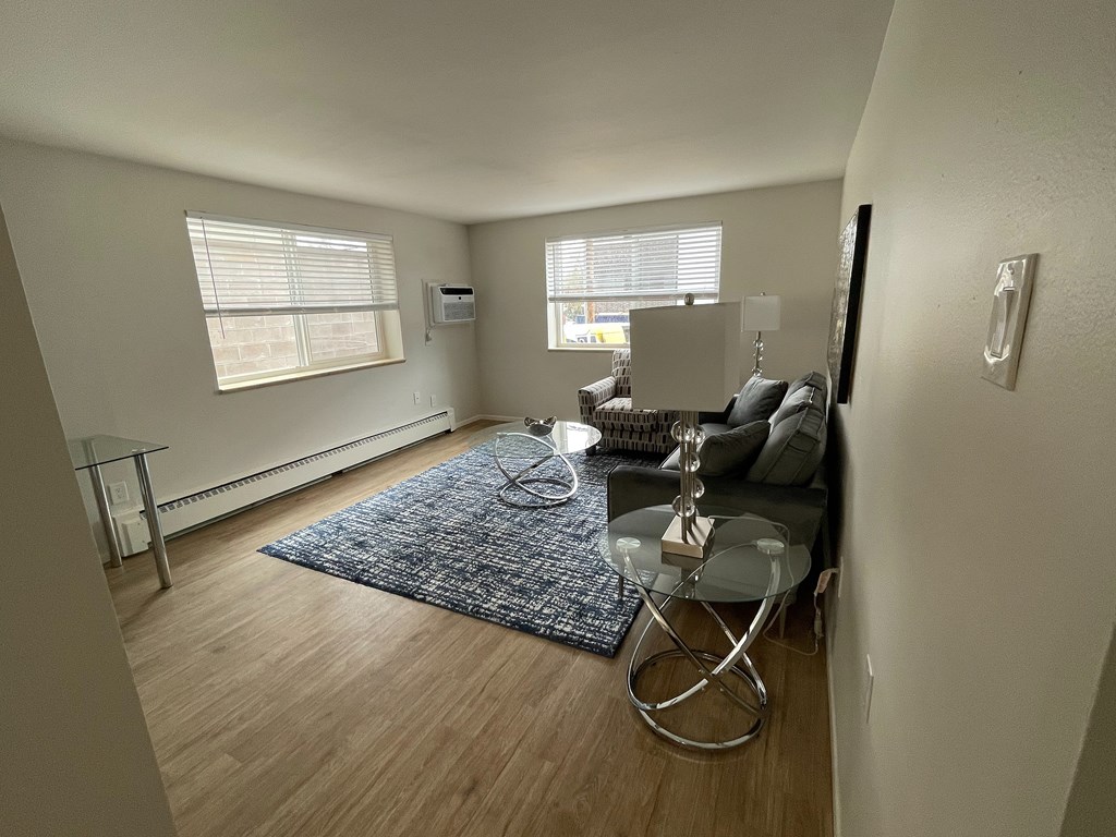 A white bathroom with a tub, toilet and sink.