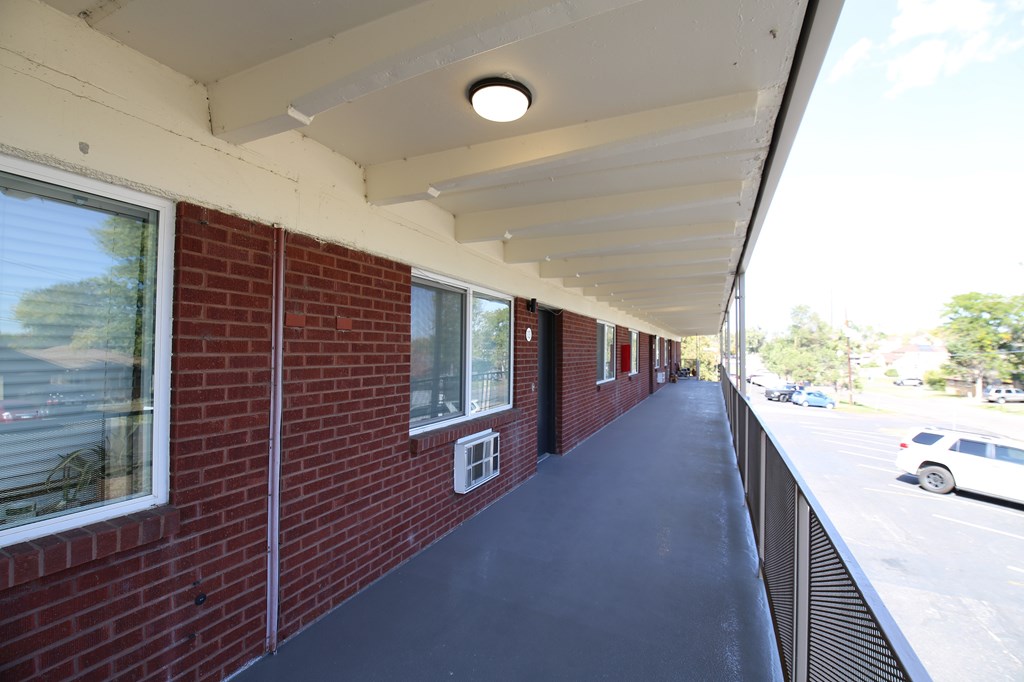 A room with a white door and a white wall.