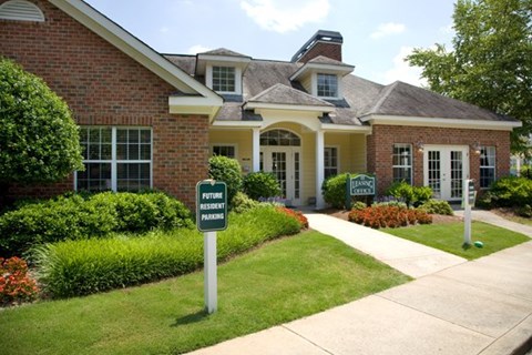 a house with a lawn sign in front of it