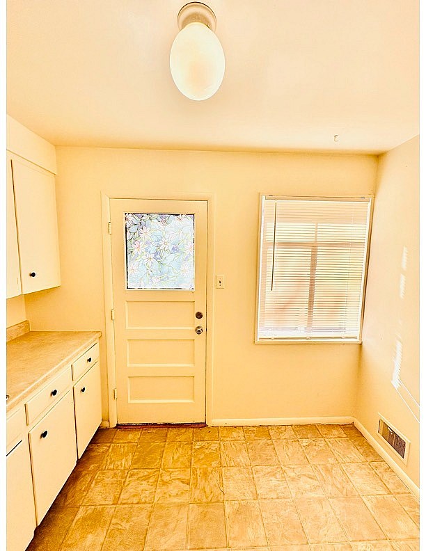 A room with a door and a window.