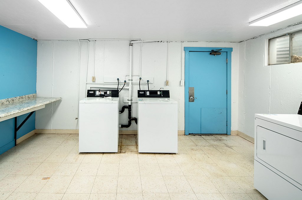 A laundry room with a washer and dryer.