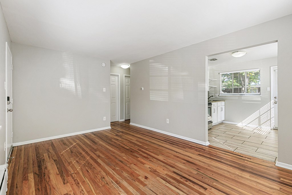A bathroom with a white sink, toilet, and bathtub.
