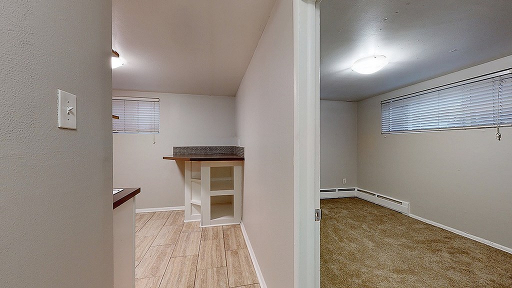 A room with a table and chairs in it.