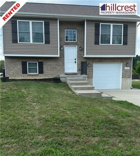 A two-story house with a garage is for rent.