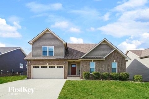 A house with a garage is for sale by FirstKey Homes.