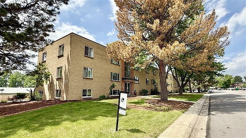 A building with a sign in front of it.