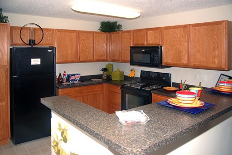 kitchen with a black fridge at Palmera, Columbia, 29229 
