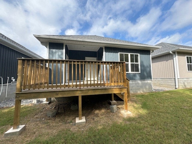 A house with a wooden deck in front of it.