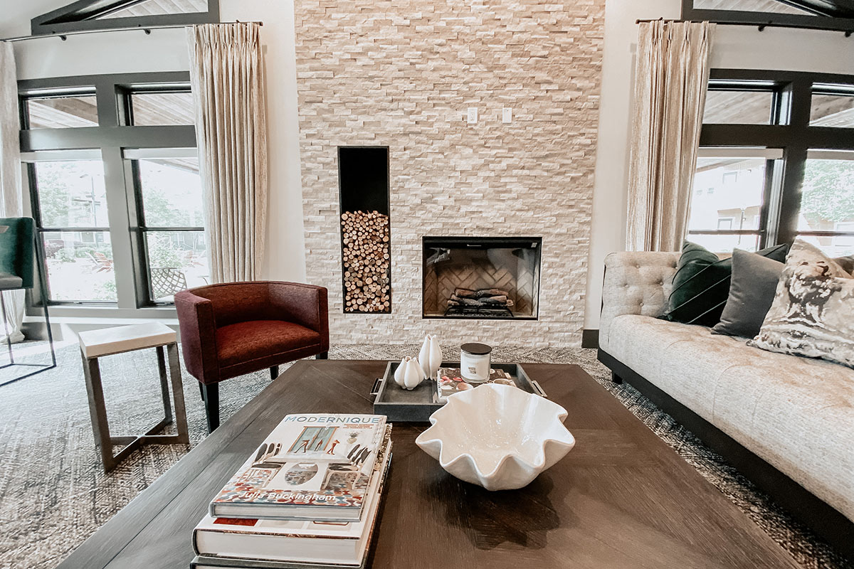 a living room with a fireplace and a couch and a coffee table