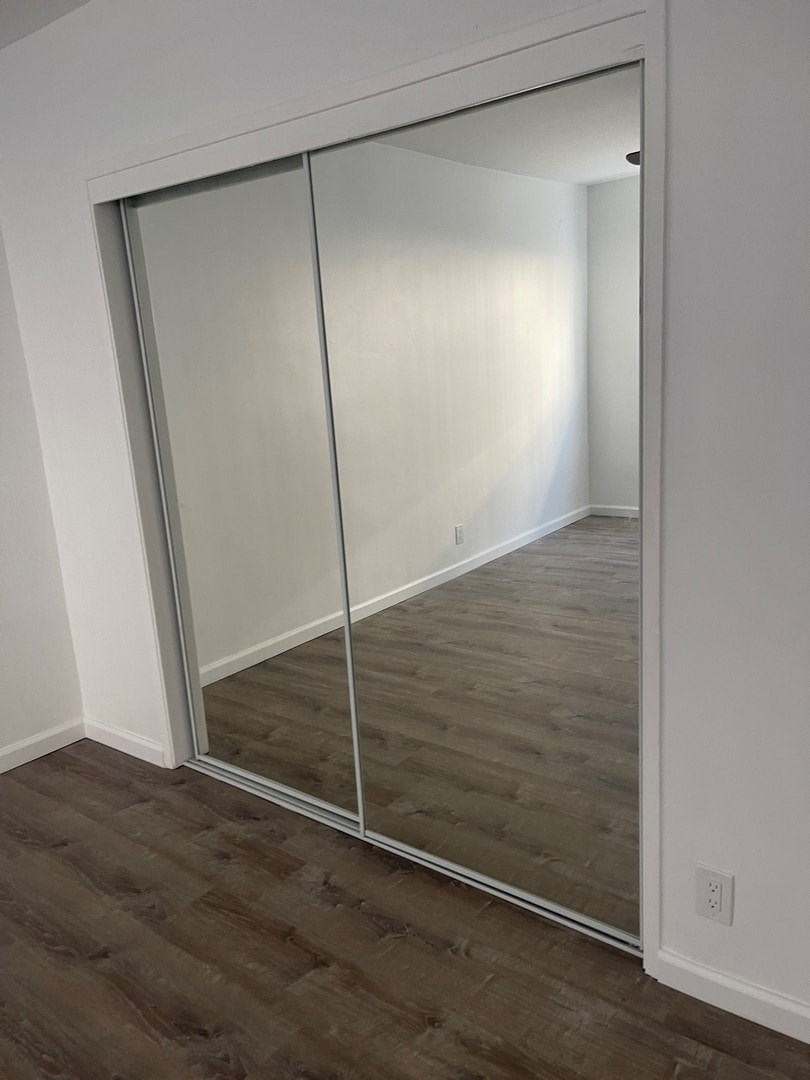 A room with a sliding glass door.