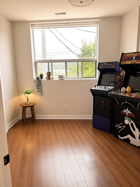 A room with a basketball arcade machine.