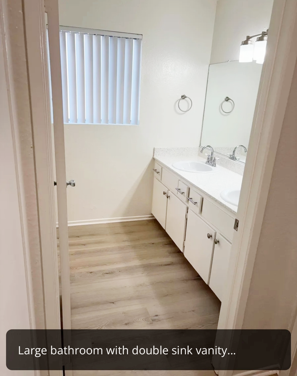 A large bathroom with a double sink vanity.