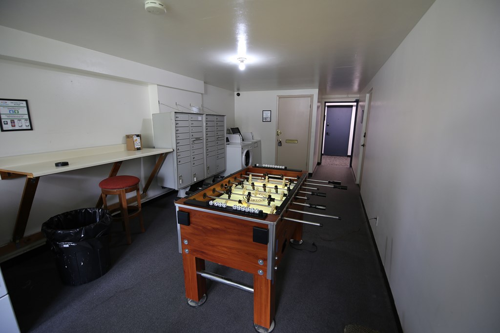 A room with a table and a chess board on it.