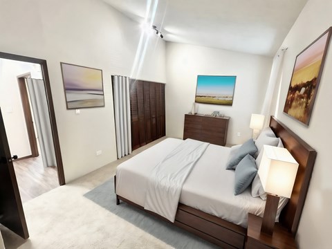 A bedroom with a large bed and a painting on the wall.