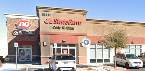 A Dairy Queen and a State Farm office building are next to each other.