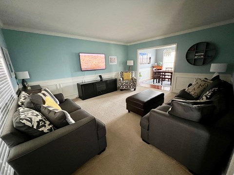 A living room with two couches and a coffee table.