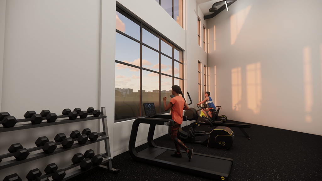 A man is running on a treadmill in a brightly lit gym.