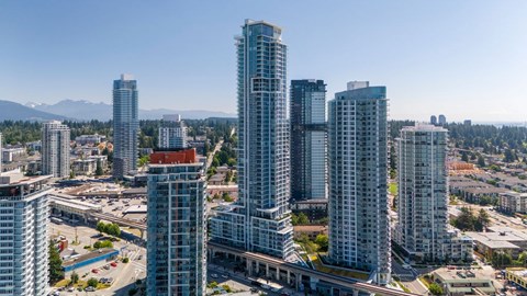 A cityscape with tall buildings and a clear sky.