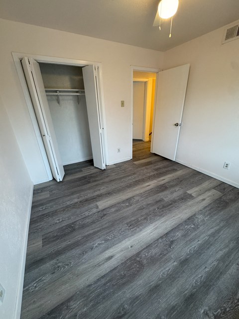 A room with a grey floor and white walls.