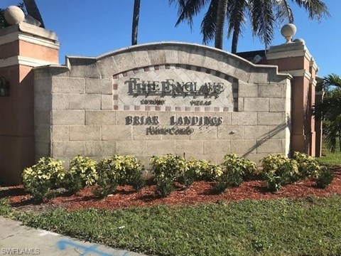 The England Country Club sign is on a wall.