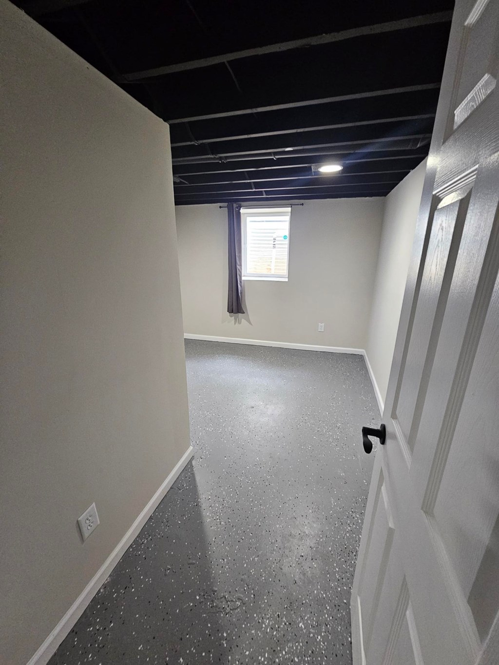 A room with a door and a window.