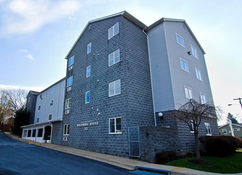 A large grey building with the words "Vincent House" on the front.